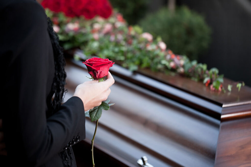 woman-at-funeral-with-coffin